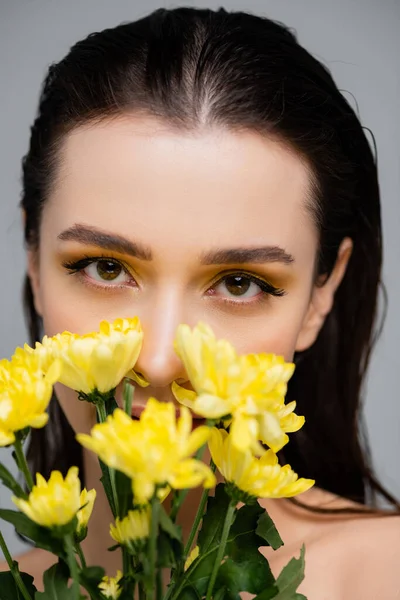Young Woman Makeup Looking Camera Covering Face Yellow Flowers Isolated — Stock Photo, Image