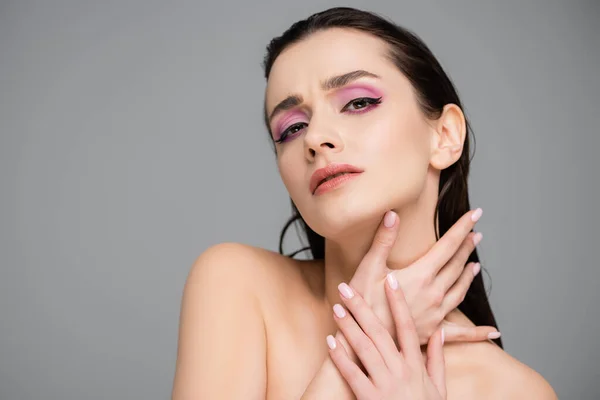 Young Displeased Woman Pink Eye Shadows Bare Shoulders Looking Camera — Stock Photo, Image