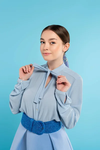 Elegant Woman Touching Bow Blouse While Smiling Camera Isolated Blue — Stock Photo, Image