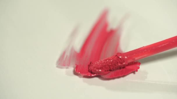 Close Pink Lip Gloss Making Strokes White — Stok Video