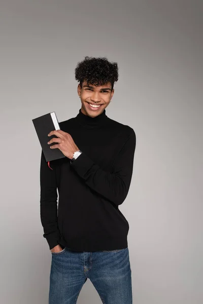 Cheerful African American Man Turtleneck Sweater Holding Notepad Isolated Grey — Stock Photo, Image