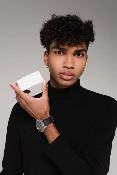 Young African American Man Turtleneck Sweater Holding Blank Card Isolated — Stock Photo, Image