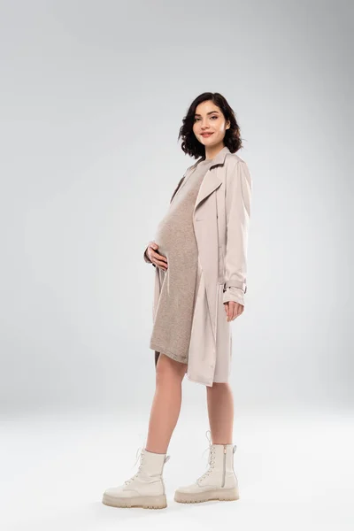 Stylish Pregnant Woman Coat Boots Smiling Grey Background — Stock Photo, Image