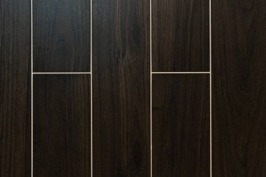 background of dark brown, rectangular tiles with wood surface imitation, top view clipart