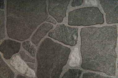 Gri, pürüzlü taşlar döşeme arka planı, üst görünüm