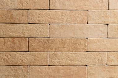 background of pale brown wall, made of natural bricks, top view clipart