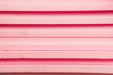 istiflenmiş, pembe genişletilmiş plastiğin arkaplanı
