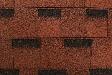 brown, grainy background of bituminous roofing tiles, top view clipart