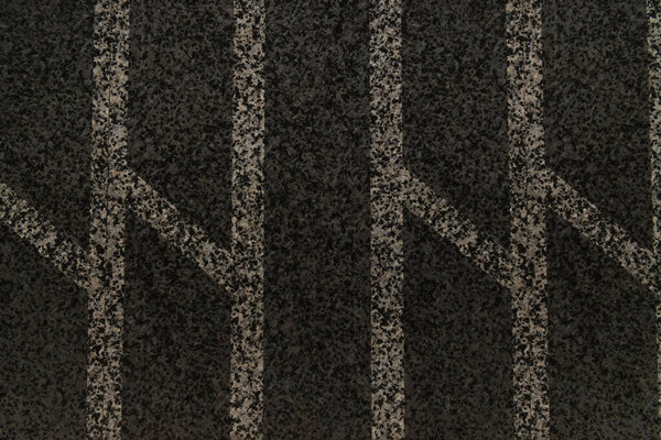 black granite background, with abstract geometric pattern, top view