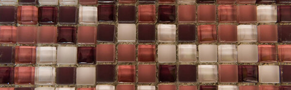 background of small, multicolored glass tiles, top view, banner