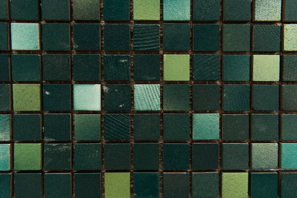 dark background with small, multicolored stone tiles, top view