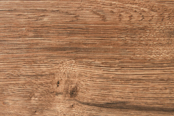 background of brown, wooden textured surface, top view