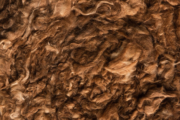 brown faux fur textured background, top view