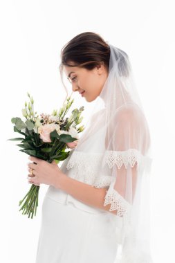 side view of pregnant bride holding wedding bouquet isolated on white clipart