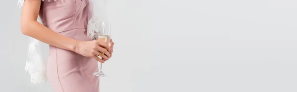 stock image cropped view of bride with glass of champagne isolated on grey, banner