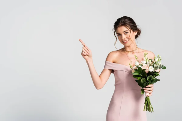 Happy Woman Pointing Finger While Holding Wedding Bouquet Isolated Grey — Stock Photo, Image