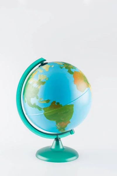 stock image earth globe on stand isolated on grey, ecology concept