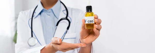 Cropped View African American Doctor Pointing Hand Bottle Cbd Lettering — Stock Photo, Image