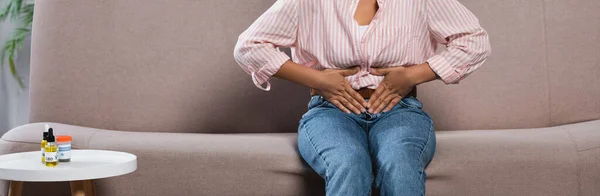Partial View African American Woman Suffering Abdominal Pain While Sitting — Stock Photo, Image