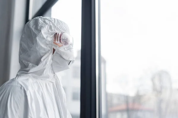 Scientist Medical Mask Goggles Hazmat Suit Standing Window — Stock Photo, Image