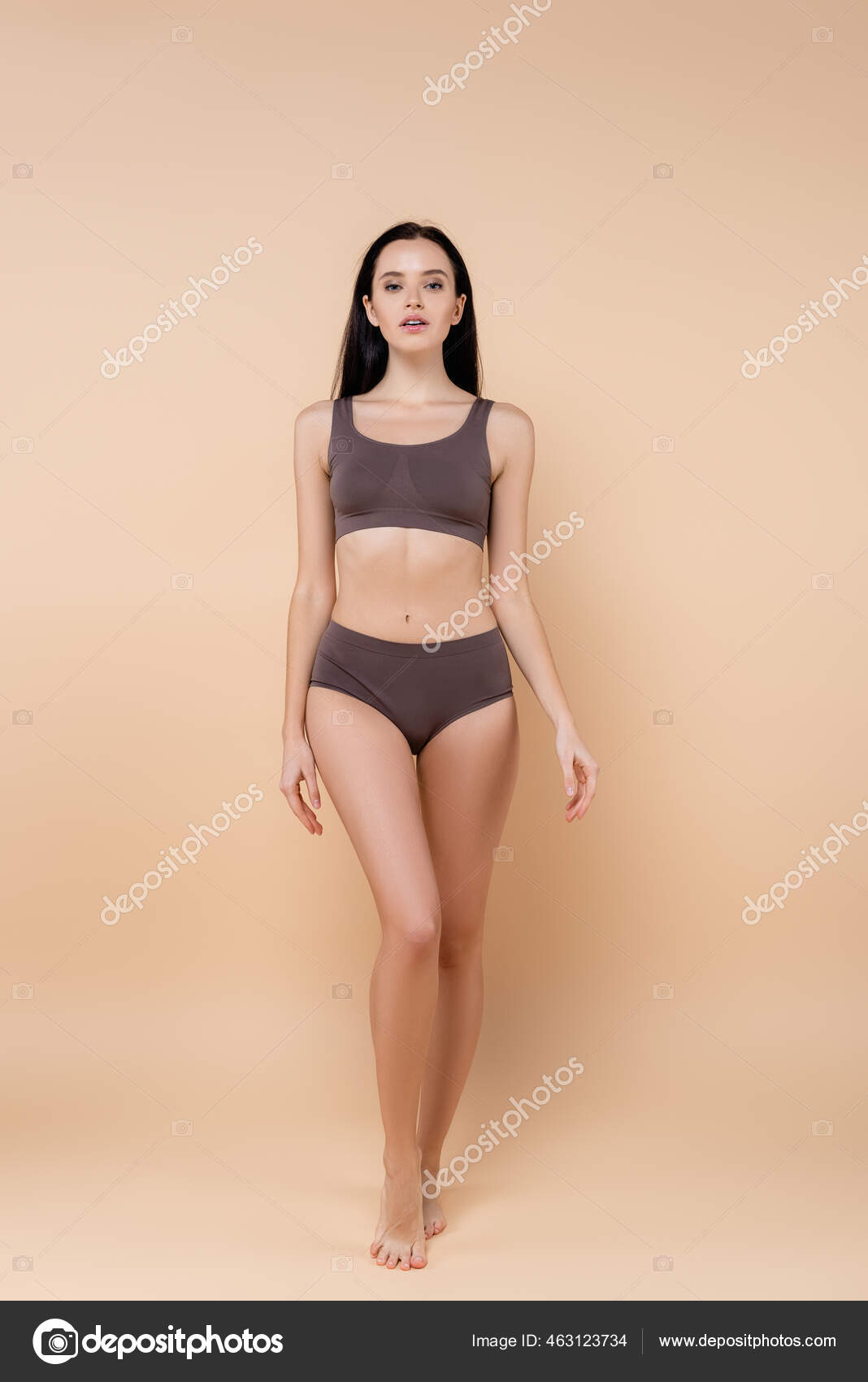 Young woman standing in top and underpants, hand pulling on underwear, rear  view - Stock Photo - Masterfile - Premium Royalty-Free, Code: 632-07161321