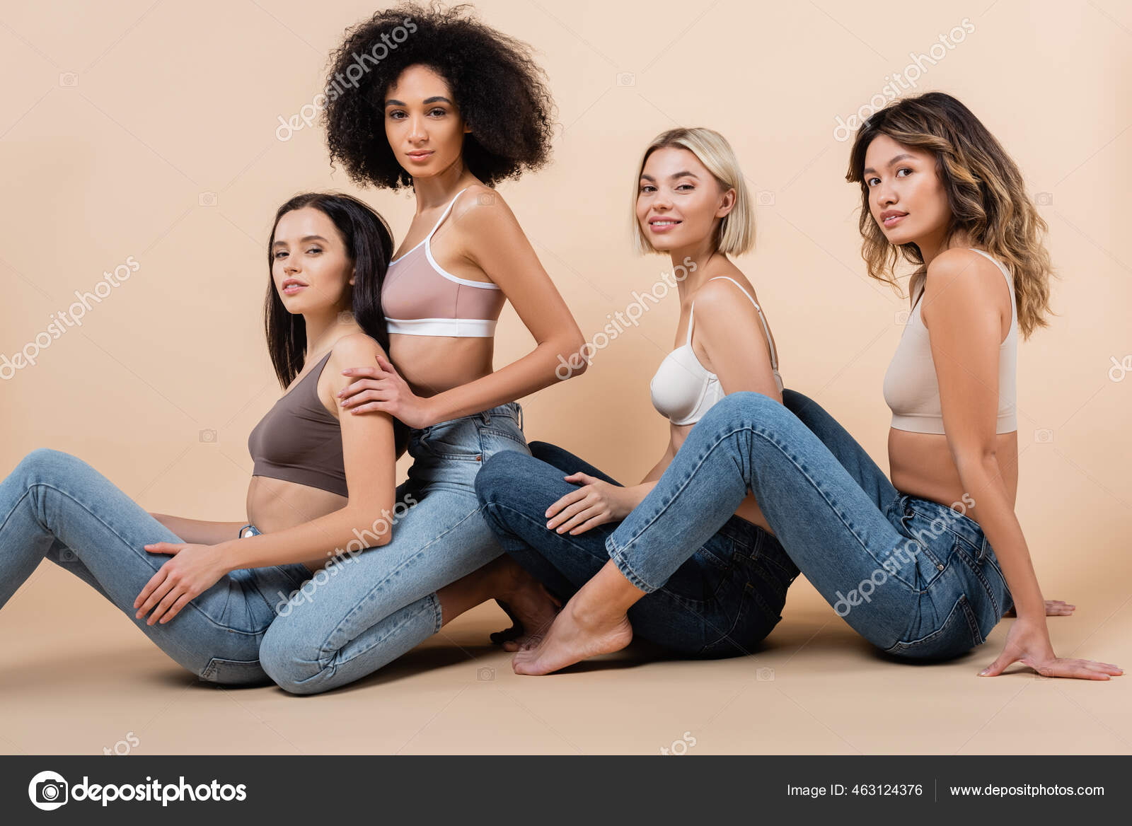 Young Multiethnic Women Bras Jeans Looking Camera Beige Stock Photo by  ©IgorVetushko 463124376