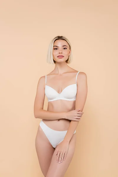 Blonde Woman White Underwear Looking Camera Isolated Beige — Stock Photo, Image