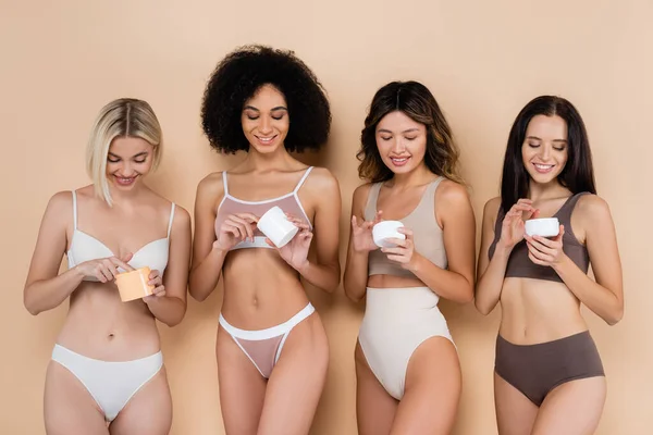 Joyful Interracial Women Underwear Holding Body Cream Beige — Stock Photo, Image