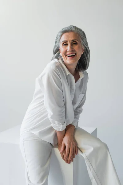 Cheerful Woman Looking Camera Cube Isolated Grey — Stock Photo, Image