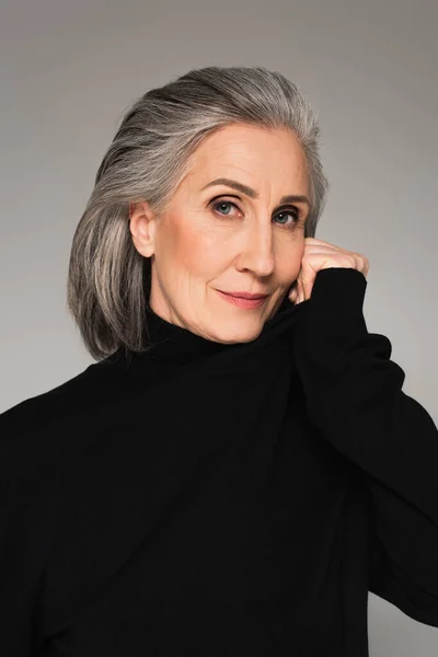 Grey Haired Woman Black Jumper Looking Camera Isolated Grey — Stock Photo, Image
