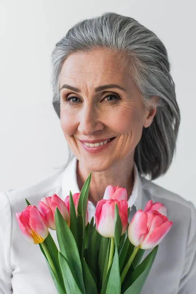 Mature Woman Tulips Smiling Camera Isolated Grey — Stock Photo, Image