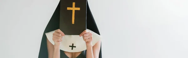 Cropped View Sexy Nun Obscuring Face Bible Isolated Grey Banner — Stock Photo, Image