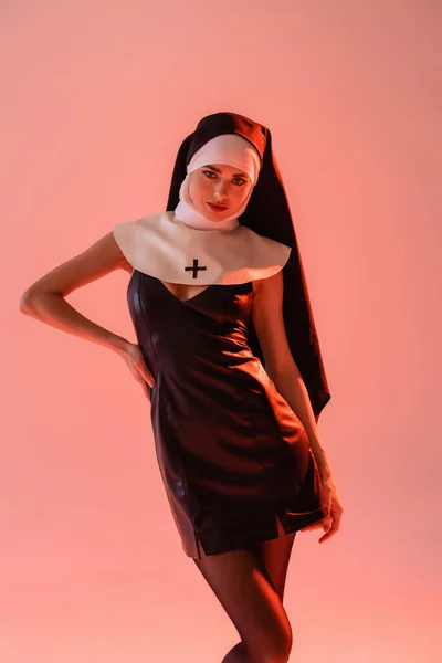 Sexy Nun Black Leather Dress Posing Hand Hip Isolated Pink — Stock Photo, Image