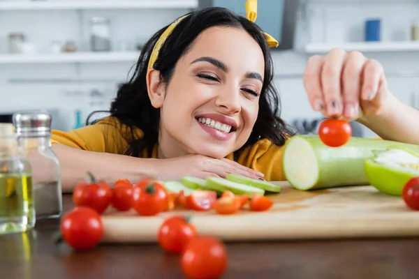 Happy Young Woman Holding Ripe Cherry Tomato Vegetables Blurred Foreground — Stock Photo, Image