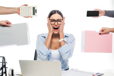 shocked businesswoman shouting with closed eyes at workplace near coworkers isolated on white clipart
