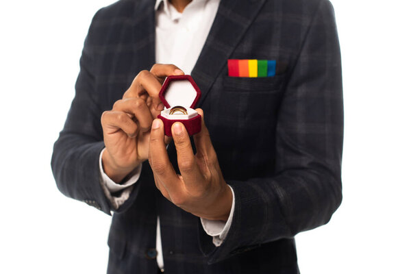 cropped view of african american man with handkerchief in lgbt colors showing wedding ring isolated on white