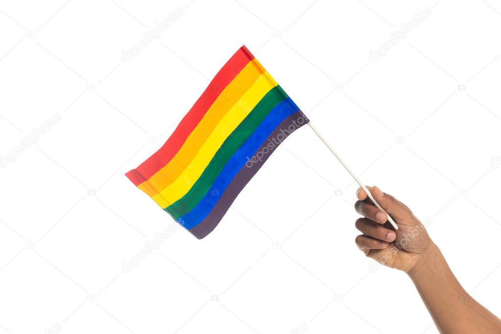 partial view of african american man holding small lgbt flag isolated on white