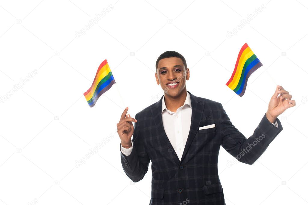 happy african american businessman with makeup holding lgbt flags isolated on white