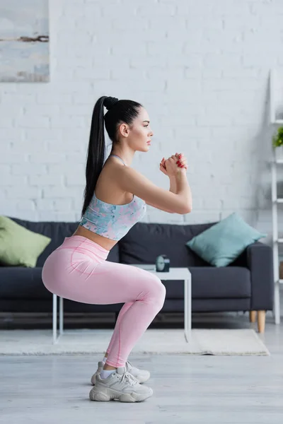 Side View Brunette Woman Sportswear Exercising Awkward Pose Clenched Hands — Stock Photo, Image