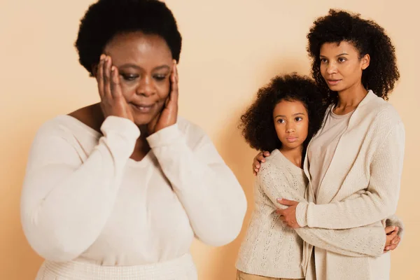 African American Mother Embracing Daughter Looking Disappointed Grandmother Hands Head — Stock Photo, Image