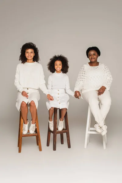 Smiling African American Mother Daughter Grandmother Holding Hands Sitting Stools — Stock Photo, Image