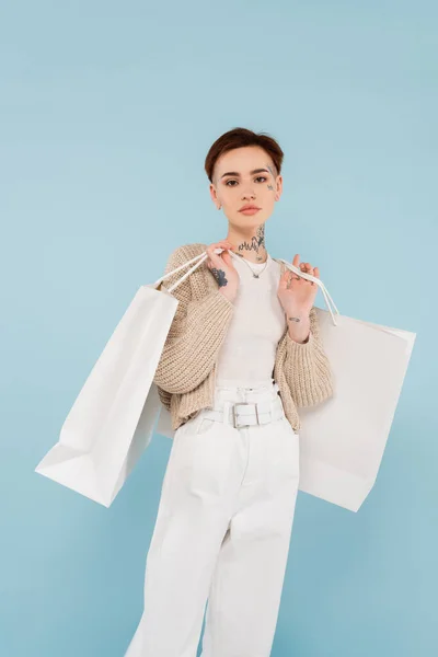 Young Woman Tattoos Holding Shopping Bags Isolated Blue — Stock Photo, Image