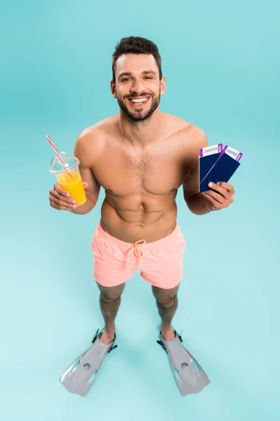 High Angle View Positive Shirtless Man Holding Orange Juice Passports — Stock Photo, Image