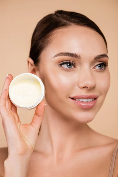 Pretty Woman Natural Makeup Holding Cosmetic Cream Isolated Beige — Stock Photo, Image