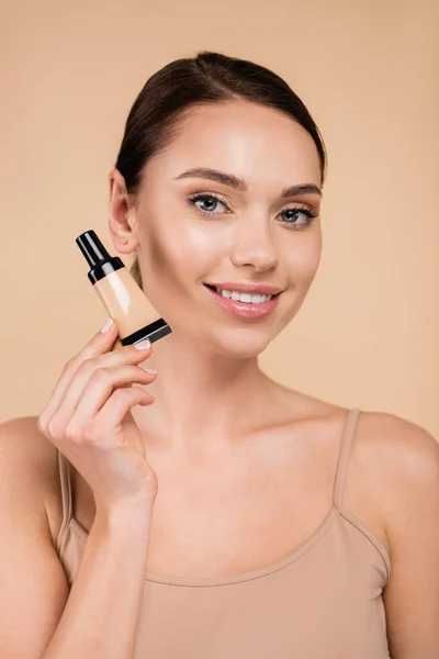 Young Woman Natural Makeup Holding Tube Concealer Isolated Beige — Stock Photo, Image