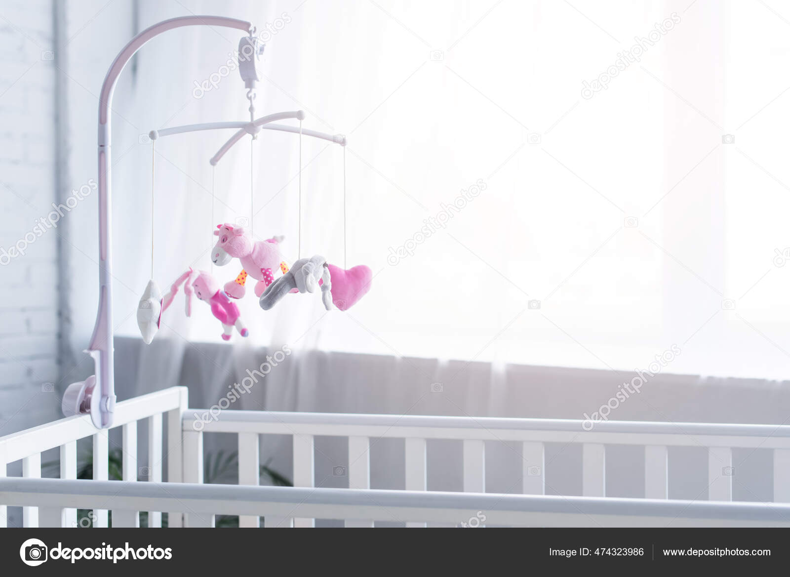 Toy that hangs over cheap crib