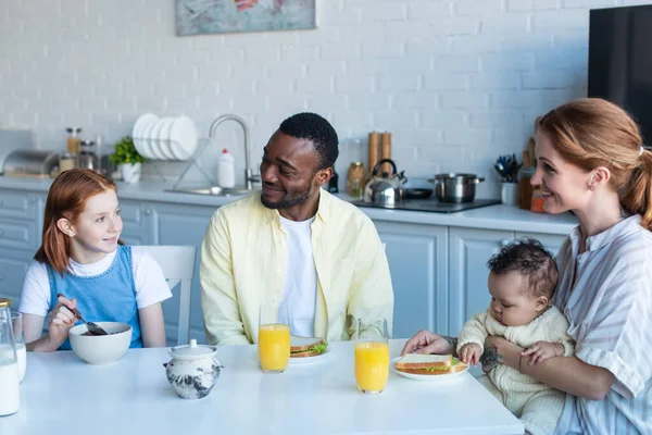 Happy Girl Eating Corn Flakes Smiling Interracial Family — Stock Photo, Image