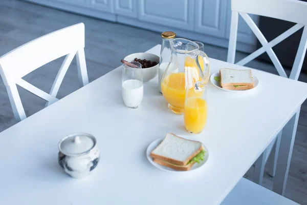 Sandwiches Crunchy Corn Flakes Milk Orange Juice Served Kitchen Table — Stock Photo, Image