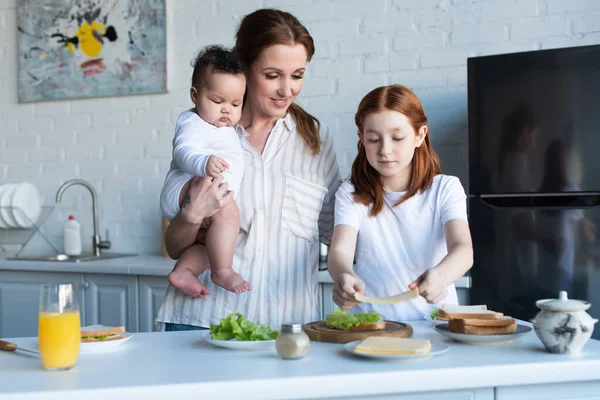 Happy Woman Holding Infant African American Baby Daughter Preparing Sandwiches — Stock Photo, Image