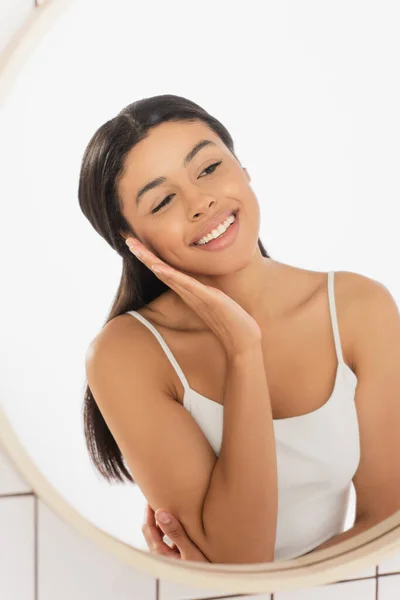 Smiling Young African American Woman Looking Mirror Hand Face Bathroom — Stock Photo, Image
